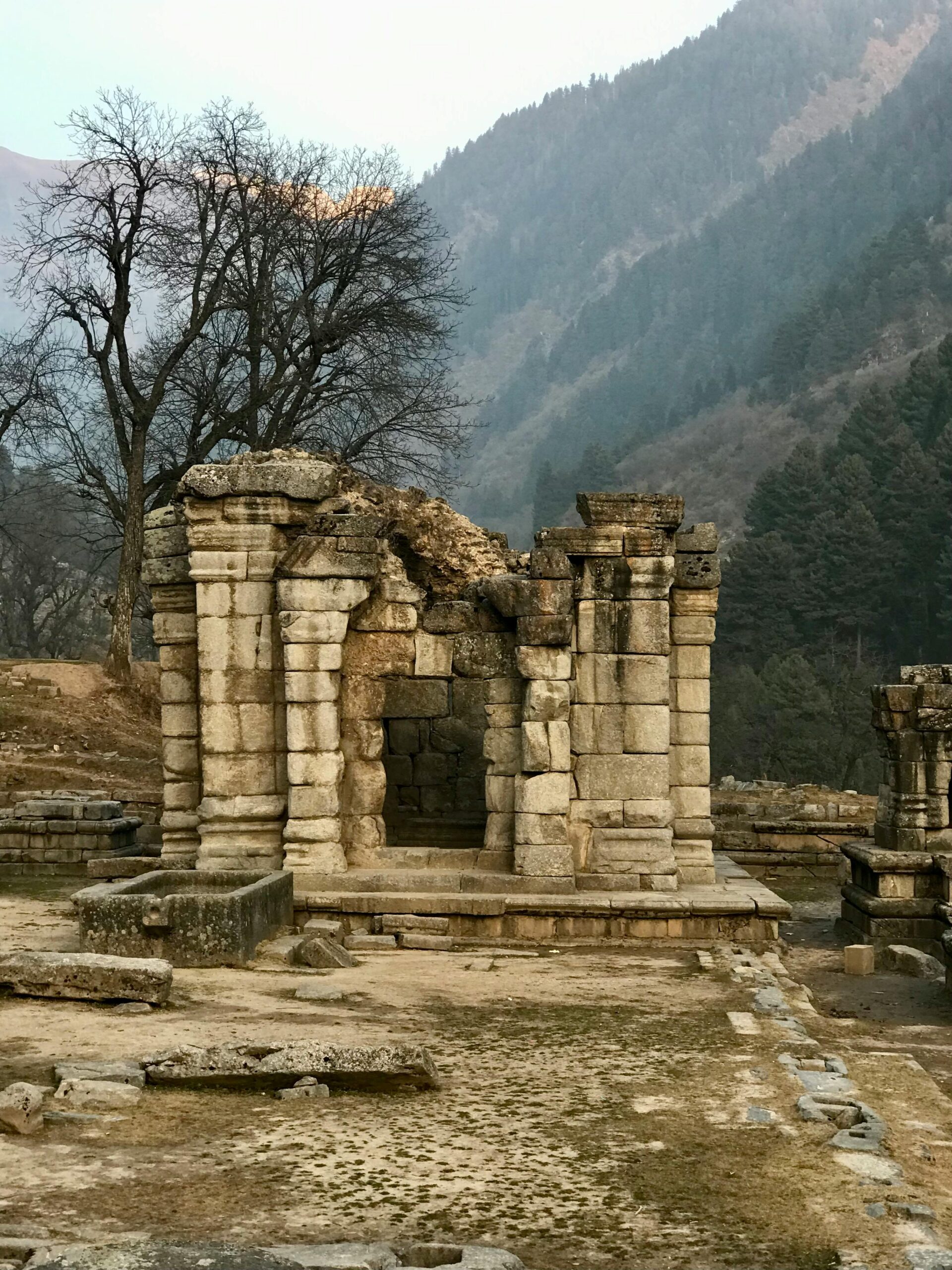 Explore historic stone ruins set against the picturesque Ganderbal mountains.