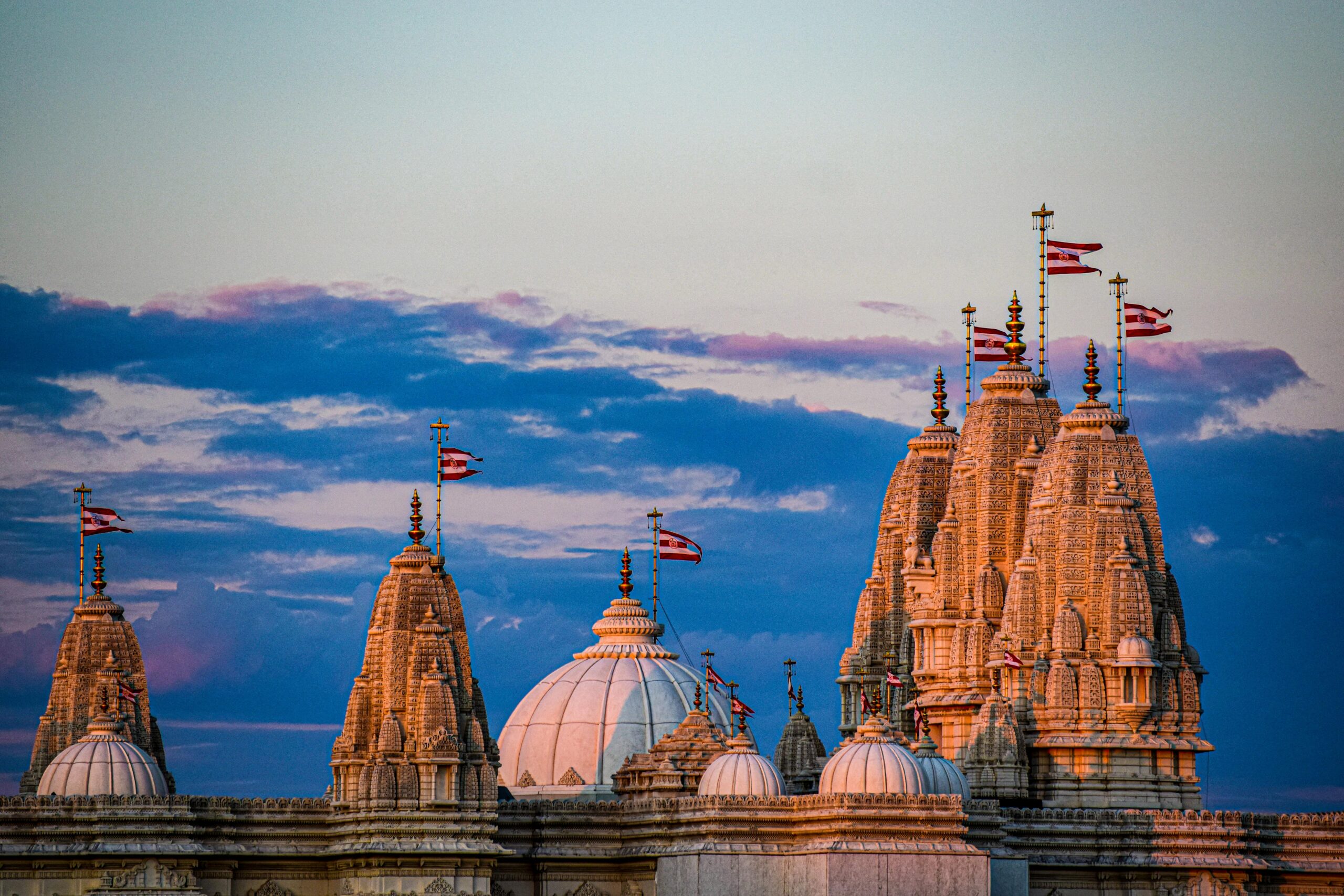 Serene view of temple towers at sunset in Toronto, showcasing stunning architecture and vibrant colors.
